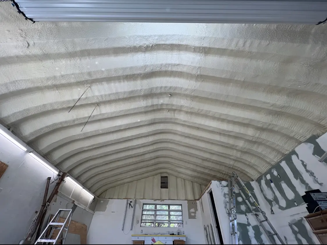 Spray polyurethane foam applied to the underside of a metal roof deck in Tolleson